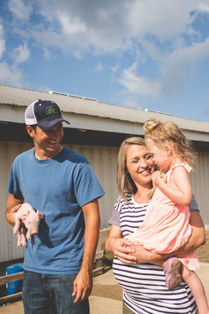 Family Holding Piglet