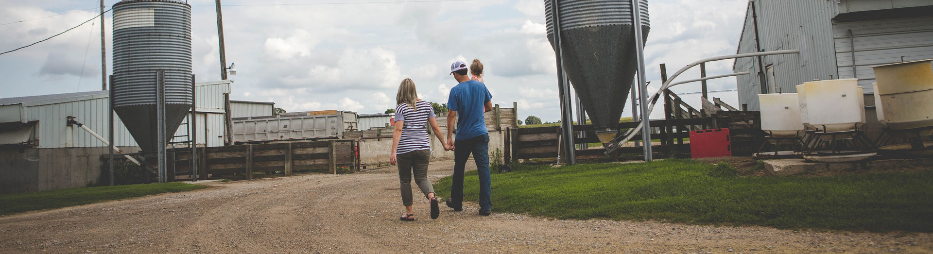 Family Walking Through Farm