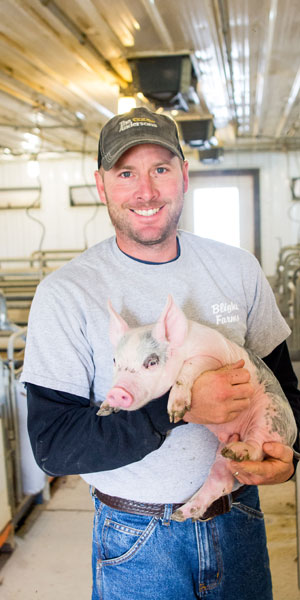 Man Holding Piglet